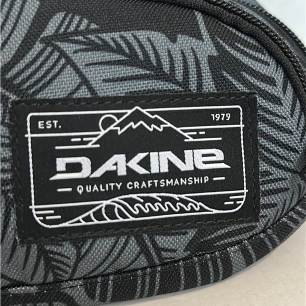 Dakine hip pack with a palm leaf pattern